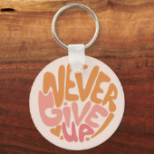 Never 与え Up – 日々ピンクとオレンジやる気を起こさせる キーホルダー (正面)