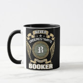 NEVER_UNDERESTIMATE_POWER_OF_A_BOOKER マグカップ (左)