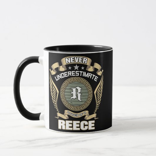 NEVER_UNDERESTIMATE_POWER_OF_A_REECE マグカップ (左)