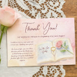 New Chapter Pink Rose & Ring Heart Bridal Shower サンキューカード<br><div class="desc">Thank your guests for attending your bridal shower with this beautiful card. Features a pink and peach watercolor design with a single pink rose and an engagement ring balanced in the open pages of a book forming a heart shaped shadow. The text thanks your guests for helping you to celebrate...</div>