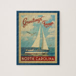 North Carolina Jigsaw Puzzle Sailboat Retro Travel ジグソーパズル<br><div class="desc">This Greetings From North Carolina vintage travel nautical design features a boat sailing on the water with seagulls and a blue sky filled with gorgeous puffy white clouds.</div>