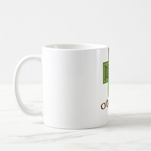 O'Donnellのロゴの緑およびブラウン コーヒーマグカップ (左)