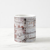 Old painted brick wall with peeling white paintwal コーヒーマグカップ (中央)