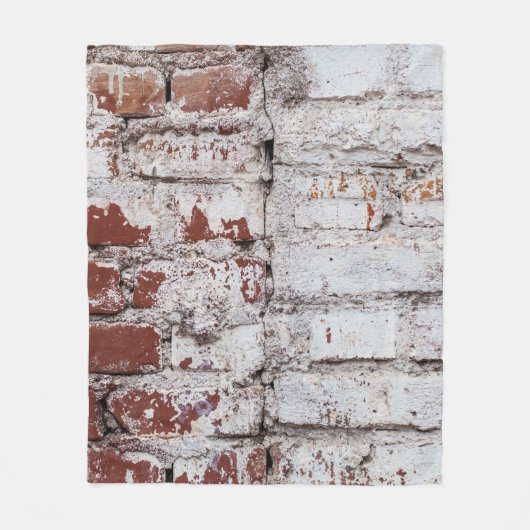 Old painted brick wall with peeling white paintwal フリースブランケット (正面)