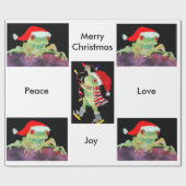 Papperを包んでいるクリスマスのサンタのカエル ラッピングペーパー (フラット)