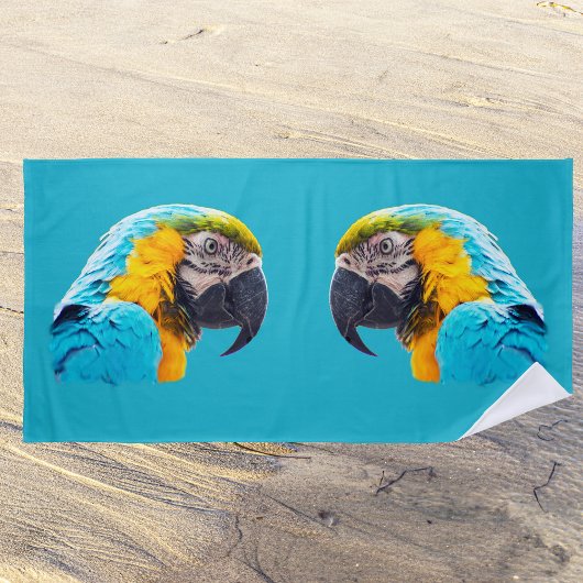 Parrot portrait on a turquoise background ビーチタオル