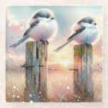 Pastel Watercolor Birds Fencepost Sunset ガラスコースター<br><div class="desc">Soft watercolor brushwork captures two fluffy songbirds resting on weathered fence posts as a glowing sunset spreads across a dreamy countryside sky. Gentle washes of peach, blush pink, pale blue, and warm gold blend into a tranquil horizon, creating a calm pastoral atmosphere. The birds appear round and feathery, their delicate...</div>