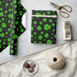 Pattern of green shamrocks on black background ラッピングペーパー