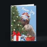 Peace Joy Sloth Christmas Sloth in Santa Hat Card シーズンカード<br><div class="desc">クリスマスグリーティングカード。サンタ帽をかぶった可愛らしく愛らしいナマケモノがのまわりにクリスマスの木飾を覗き見る。Peace,  Joy,  Sloth文字のカバーと中のリラックス休日のメッセージ。画像包まれたの下部にクリスマスプレゼント。アート、画像、詩の著作権© Shoaff Ballanger Studios,  2023.</div>