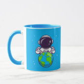 Peaceful Astronaut Holding Planet Earth マグカップ (左)