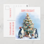 Penguin family joyfully decorating a Christmas tre ポストカード (正面/裏面)