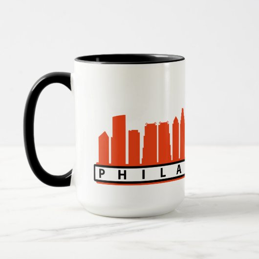 Phillyのオレンジ及び黒の2019年のスカイラインのマグ マグカップ (左)