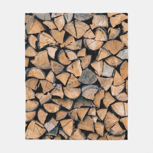 Pile of brown firewood フリースブランケット (正面)