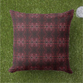 Pink And Red Dots And Squiggles Pattern On Black アウトドアクッション (芝生)