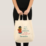 Pre-K Graduate Cute 2023 Owl Funny Graduation Name トートバッグ<br><div class="desc">A cute tote bag for a pre-k grad featuring an illustration of an orange and yellow owl posing on books with it's pencil and wearing a grad cap. "I'm a Pre-K Graduate!" Great for kids graduating from pre-kindergarten education and ready to advance to first grade schooling</div>
