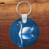 Pretty white swan floating on a blue lake キーホルダー (正面)