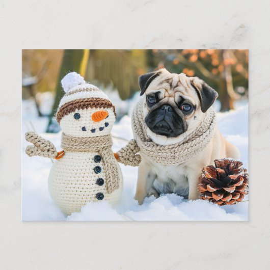 Pug Sitting Next to Snowman in Winter ポストカード (正面)
