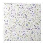 Purple Floral Ceramic Tile タイル<br><div class="desc">Bring a breath of fresh air into your space with this soft purple floral design, featuring a delicate scatter of lavender, lilac, and soft blue blossoms intertwined with gentle green foliage. The airy, hand-painted look creates a calm, romantic feel reminiscent of a quiet spring meadow - perfect for brightening your...</div>