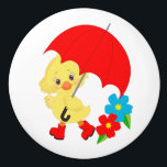 Rainy Day Yellow Duck Kid's Room セラミックノブ<br><div class="desc">This cute knob features an adorable yellow duck wearing red galoshes and carrying a bright red umbrella. Beside the duck are red and blue flowers. Bright and colorful for any child's room!</div>