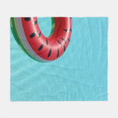 Red and green lifebuoy on swimming pool フリースブランケット (正面(横))