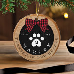 Red Bow Paw Print Memorial Pet Photo Wood Slice セラミックオーナメント<br><div class="desc">Rustic pet memorial photo ornament featuring a rustic faux wood slice background decorated with a buffalo red plaid bow and white paw print. Customize with your pet's name ,  year born,  year passed and monogram. The reverse side features a place to add your pet's photo. Designed by Moodthology Papery</div>