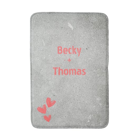 Red graffiti name on gray concrete, your バスマット (正面縦)