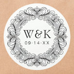 Rococo Couple's Initials Wedding or Save the Date ラウンドシール<br><div class="desc">Adorn your invitations, favors, or gifts with these captivating custom labels, featuring an exquisite circular border of ornate Baroque scrollwork. This artistic wreath beautifully frames your personalized monogram initials and an important date, adding a sophisticated and luxurious touch to any item. These high-quality, peel-and-stick labels offer ultimate convenience, providing a...</div>