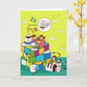 Rubikの立方体のパズルに坐っている女の子を持つ男の子 カード (黄色い花)