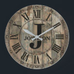 Rustic Johnson Family Clock | Farmhouse Decor  ラージ壁時計<br><div class="desc">Celebrate the Johnson family legacy with this stunning rustic monogram wall clock that brings timeless elegance to any home. 🕰️ Featuring a weathered wood-look background with vertical planks, a decorative ornate border, and Roman numerals framing a classic monogram design with a large J initial, the Johnson family name in bold...</div>