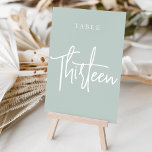 Sage Green Hand淡い色のスクリプト化テーブルIZEN テーブルナンバー<br><div class="desc">Sage Greenと淡い色のWhiteのシンプルとシックなテーブルナンバカードは、お使いのイベントでエレガント声明を結婚出す。デザインは、クラシックserifと手書きスクリプトレタリングのeyecatchingミックスの"table [number]"を特徴とする。デザインは両側で繰り返される。個別の番号カードは別々に販売し、各テーブル番号を私たちのコレクションから個別に注文。</div>