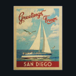 San Diego Postcard Sailboat Vintage California ポストカード<br><div class="desc">This Greetings From San Diego California vintage travel nautical design features a boat sailing on the water with seagulls and a blue sky filled with gorgeous puffy white clouds.</div>