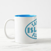 Sanibelの島のフロリダの青い楕円形 ツートーンマグカップ (左)