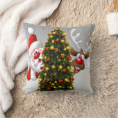 Santa claus and reindeer behind a christmas tree.j クッション (ブランケット)