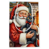 Santa Claus Holding Black Cat Christmas Art ミディアムペーパーバッグ (正面)