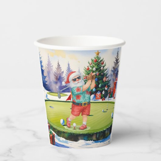 Santa Claus is golfing on Christmas golf course 紙コップ (正面)