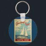 Santa Cruz Sailboat Vintage Travel California キーホルダー<br><div class="desc">This Greetings From Santa Cruz California vintage travel nautical design features a boat sailing on the water with seagulls and a blue sky filled with gorgeous puffy white clouds.</div>