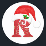 Santa hat Christmasのモノグラム文字R ラウンドシール<br><div class="desc">サンタハットとホリークリスマスステッカー付きモノグラム文字R</div>