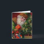 Santa in Greenノートカード シーズンカード<br><div class="desc">サンタさんはラデンのおもちゃやクリスマス応援のバッグを持っている。隣り合う木には輝くビーズと蝋燭が飾白熱［赤熱］光を放つられている。サンタさんは皆さんに黄金のレタリングでメリークリスマスを祝う。この鮮やかはがきの色と精巧な詳細はビクトリアン、あなたの休日の対応と装飾品のための完璧なイメージを提供する。</div>
