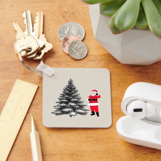 Santa standing near pine tree キーホルダー (デスク)