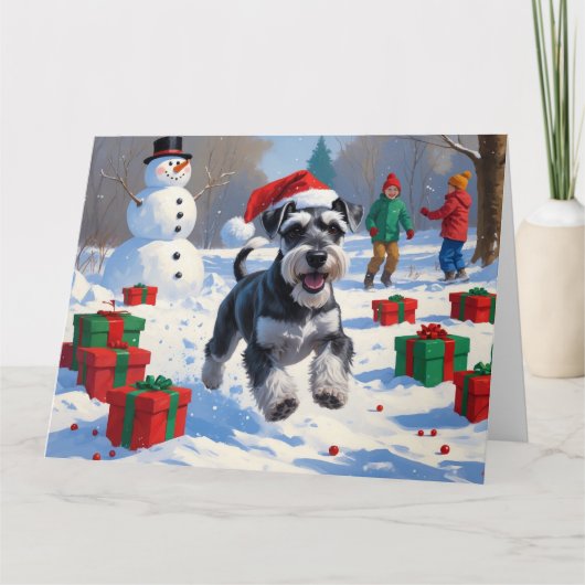 Schnauzer Running in Snow with Christmas Hat カード (正面)
