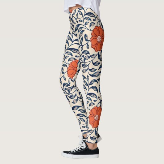 Seamless floral pattern with vibrant orange flower レギンス (左)