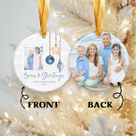 Seas and Greetings Seashell Holiday Photo セラミックオーナメント<br><div class="desc">Seas and Greetings Seashell Ornament on Coastal Wood Holiday Christmas Photo Ornaments featuring ocean navy blue and sandy tan shell ornaments hanging from sailing jute rope on coastal shiplap wood with elegant typography. Add two of your photos and a personal message for a fun nautical holiday ornament or gift. Please...</div>