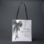 She’s Tying The Knot Black Bow Bridal Shower トートバッグ<br><div class="desc">Celebrate the bride-to-be with this She’s Tying The Knot Black Bow Bridal Shower Tote Bag, designed with a chic coquette-inspired black bow and elegant modern typography. Perfect for bridal showers, bachelorette celebrations, and wedding events, this stylish tote makes a thoughtful gift for the bride, bridesmaids, or guests. Ideal as a...</div>