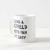sheffield sports fan, being コーヒーマグカップ (正面左)
