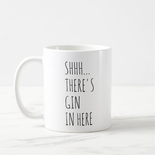 Shhh… ここにジンがあります コーヒーマグカップ (左)