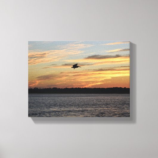 Silhouette of pelican flying over the river キャンバスプリント (正面)