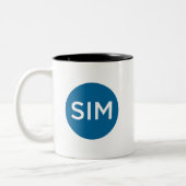 SIMチャプターロゴとタグラインティール（緑がかった色）ツートーンコーヒー ツートーンマグカップ (左)