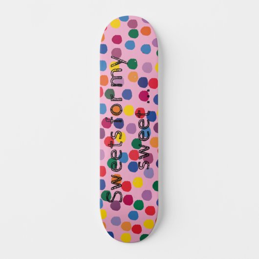 Skateboard mit bunten Punkten und rosa Hintergrund スケートボード (正面)