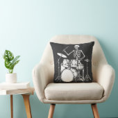 Skeleton plays the drums in rock band クッション (椅子)