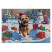 Skye Terrier Running in Snow with Christmas Hat カッティングボード (正面)
